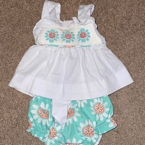 Beautiful smocked little girls outfit.
